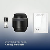 Image of Arcwave product packaging. Includes a small bottle labeled "Arcwave Clean," a cylindrical black device with a smooth, modern design, and a manual titled "Arcwave Voy Hold Tight." Text at the bottom reads "Everything you need. Already included," featuring the premium Arcwave Voy Penis Stroker for Men with Merkel-Ranvier receptors for enhanced sensation.